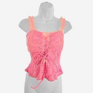 Pink lace corset top with ruffle trim and tie in front